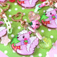 Strawberry Skunk glitter acrylic keyring w/ charms